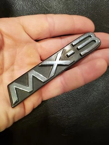 Mazda MX-3 Nameplate Chrome Script on Black Badge OEM Used Emblem  - Imagen 1 de 7
