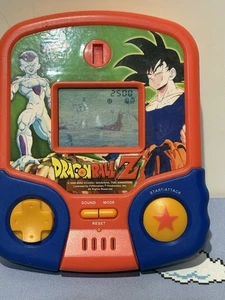 Juego de mano electrónico Dragon Ball Z 1999 vintage - MGA - probado y funciona - Imagen 1 de 7