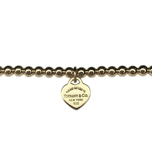 Vergoldeter Tiffany & Co Herzanhänger an markenlosem Kugelarmband in Geschenkbox - Bild 1 von 6