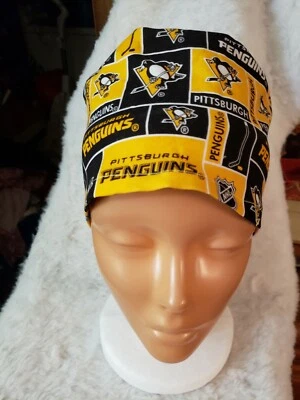 GORRAS EXFOLIANTES QUIRÚRGICAS HECHAS A MANO DE LOS PINGÜINOS DE PITTSBURGH     Foto 1 de 3