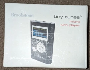 Brookstone: Tiny Tunes - Micro MP3 Player - Black - Blank Screen - Used - Picture 1 of 3