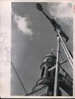 1957 Press Photo Saranac Lake NY workman painting streetlamps & poles