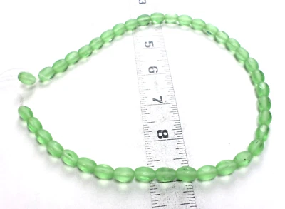 16" Strand 38 Czech Emerald Green Glass Window Pane Oval Puffed Beads 11x8mm - Image 1 of 4