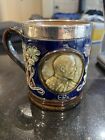 Antique Royal Doulton Lambeth Ed V11 coronation mug with silver rim .c1902
