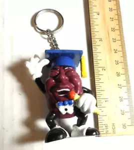 Llavero Aplausos Vintage 1988 California Raisins Graduate PVC Raison - Imagen 1 de 9