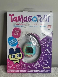 Nuevo 2022 Bandai The Original Tamagotchi Gen 1 Realidad Virtual Mascota Azul Escalas - Imagen 1 de 8