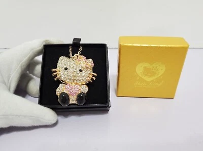 Collar Colgante Hello Kitty Diamantes de Imitación, Lazo Rosa, Corazones Tono Dorado, Hueco Foto 1 de 4