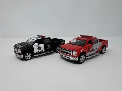 1:46 Kinsmart 2014 Chevy Silverado Police & Firefighter Truck Diecast Lot - Image 1 of 4