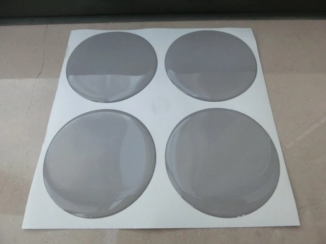 COPRIMOZZI KIT BORCHIE ADESIVO STICKERS 3D X 4 PZ 50 mm GRIGIO PEUGEOT RENAULT - Immagine 1 di 1