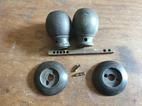 One pair of vintage Wood Ebony? door handles & 2 backplates Cover