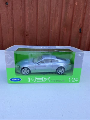 WELLY NEX  1:24 SCALE JAGUAR XK COUPE RN141280.RARE SILVER & SEALED - Image 1 of 4