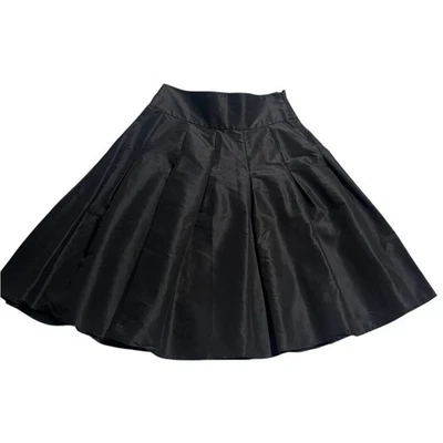 Falda plisada de tafetán de seda BCBGMaxAzria hasta la rodilla para mujer talla 4 negra circular Foto 1 de 4