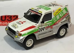 SOLIDO 1/43 MITSUBISHI PAJERO EVOLUTION #204 DAKAR 2005 PETERHANSEL - Imagen 1 de 7