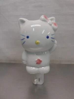 Calentador de fragancia enchufable de porcelana para gatos Foto 1 de 4
