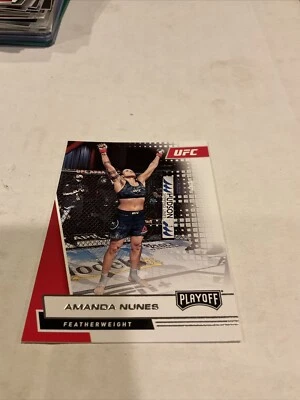 2021 PANINI CHRONICLES UFC PLAYOFF #64 AMANDA NUNES - Image 1 of 3