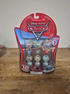 Disney PIXAR Cars 2 Squinkies Series 1 Set 12 pack w/ 3 Mystery Capsules New - Image 1 of 4