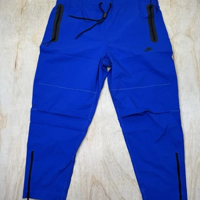 NUEVO Nike Tech Tejido Azul Real Pantalones Cónicos Elastizados Pantalones 2XL HM8241-480 Foto 1 de 4
