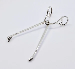 ANTIKE KONTINENTALE MASSIVE SILBERFEDER ZUCKERZANGE / NEU IN VERPACKUNG um 1930 - Bild 1 von 5