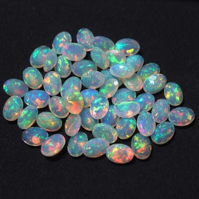 5x7 MM Natural AAAA Grade Flashy Multi Fire Ethiopian Opal Oval Cut 50 Piece Lot - Image 1 of 4