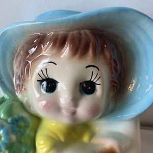 Vintage Girl on bike flowers planter ceramic blue/white/yellow pre owned. - Picture 1 of 12