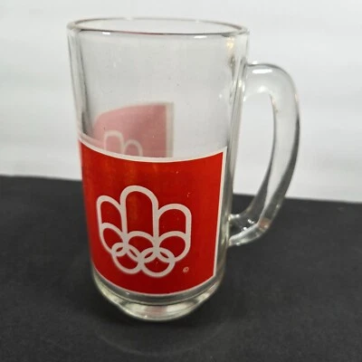 Taza de cerveza de vidrio con logotipo de los Juegos Olímpicos de Montreal Canadá 1976 con mango vintage de 5,5" de alto Foto 1 de 4