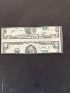 2013 REAL 2$ NOTE 2 DIFFERENT SEARIAL NUMBERS HARIZONTAL CUT - Picture 1 of 2