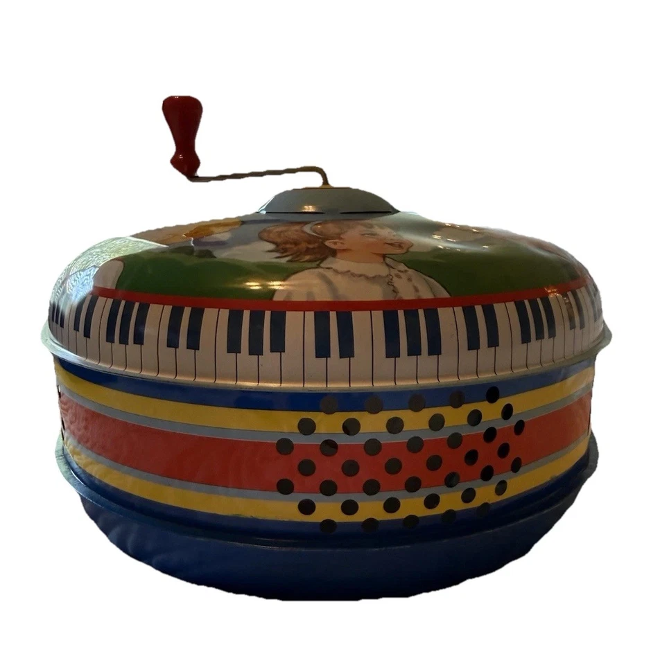 Tapa musical de hojalata Schylling juguete giratorio vintage manivela de metal coleccionable para niños Foto 1 de 4