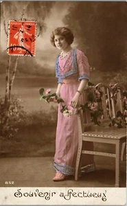  Vintage French RPPC Postcard Pretty Lady in Pink Dress by Garden Bench Flowers - Picture 1 of 3