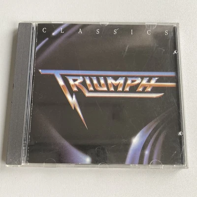 CD Triumph - Classics 11 Songs -Canada Hardrock German press Yes Rush Rik Emmett - Bild 1 von 4