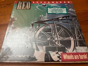 REO SPEEDWAGON Wheels Are Turnin' ORIGINAL 1984 LP in Shrink + Hype Sticker NM - Imagen 1 de 1