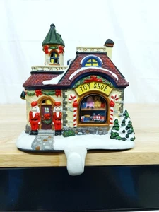 Christmas Stocking Holder Santa's Toy Shop Lighted Ceramic Village Hanger - Picture 1 of 8