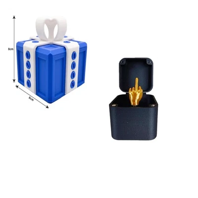 El molesto regalo con dedo medio en una caja caja de regalo con tornillos broma Foto 1 de 4