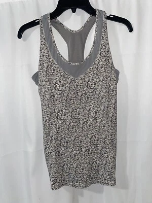 Camiseta sin mangas Lululemon Tone It Petite Fleur cuchara plateada gris ambiente para mujer talla 8 Foto 1 de 4