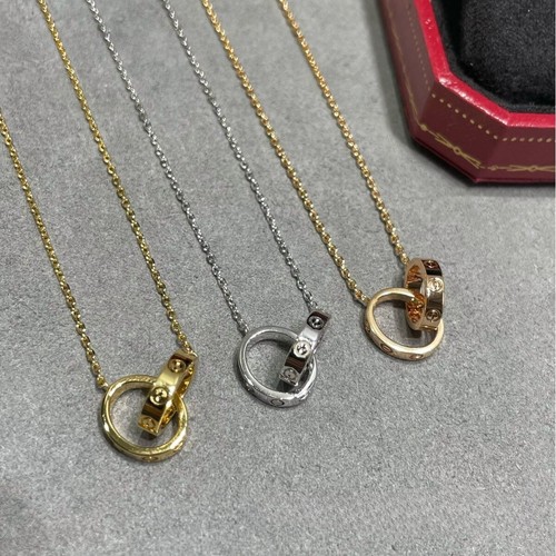 CHANEL Collana catena clavicola doppio anello fibbia corno disco volante accento diamante