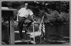 Postcard WI RPPC Man Posing on Boat With American Flag Lower Dells Wisconsin B12