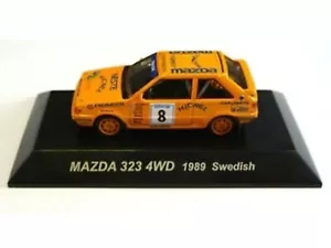 WOW EXTREMADAMENTE RARO Mazda 323 4x4 Turbo #8 Suecia 1989 WRC 1:64 CM's Kyosho-RX7 - Imagen 1 de 3