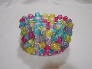 NUEVA PULSERA AJUSTABLE ELÁSTICA ROJA, AZUL, AMARILLA Y MORADA / TALLA ÚNICA - Imagen 1 de 4