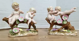 Coppia antiche statuine cherubini porcellana putti su tronco fiori stile Capodimonte - Foto 1 di 11