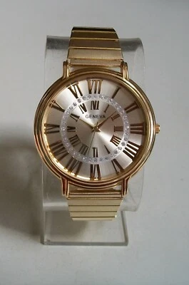 Reloj informal elegante de moda con banda elástica con acabado dorado con número romano para hombre Foto 1 de 4