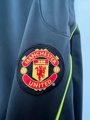 Pantalones deportivos Manchester United para hombre XL gris oscuro con detalles en verde neón buen estado Foto 1 de 4