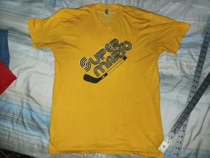 CAMISETA MARIO LEMIEUX SUPER MARIO DORADA MANGA CORTA MEDIANA - Imagen 1 de 21