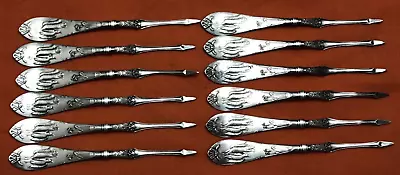 12 PICOS DE TUERCAS plateados figura de ardilla y pato con lirio 1876 "D.S.Co." Foto 1 de 4