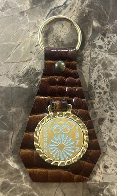 RARE Original 1972 Munich Summer Olympics Gold & Snake Skin Key Chain - Image 1 of 2