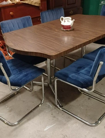 6 Segars Tubular Cantilevered Chrome And Blue Velvet Dining Chairs and a Table Cover