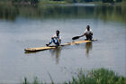794092 Tribesmen Traveling To Fish By Canoe Malaysia A4 Photo Print