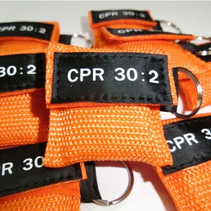 2 piezas LLAVERO MÁSCARA DE RCP CON ESCUDO FACIAL DE RCP AED Naranja RCP 30:2 - Imagen 1 de 6