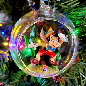 NEW 2022 Walt Disney World Parks WDW Pinocchio Glass Sketchbook Ornament - Picture 1 of 2