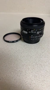 Nikon AF Nikkor 50mm 1:1.8 lens w/HOYA UV (0) filter 52mm - Picture 1 of 4