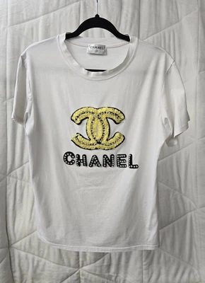 Camiseta Chanel Mujer-Blanca Con Logo Cuentas Negro Y Amarillo-Excelente Estado Foto 1 de 3