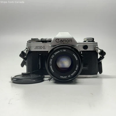 Cámara SLR vintage Canon AE-1 negra/plateada Foto 1 de 4